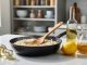 Close-up of a skillet of glossy risotto with white wine vinegar, lemon, and broth on the kitchen counter, representing substitutes when white wine isn’t available.